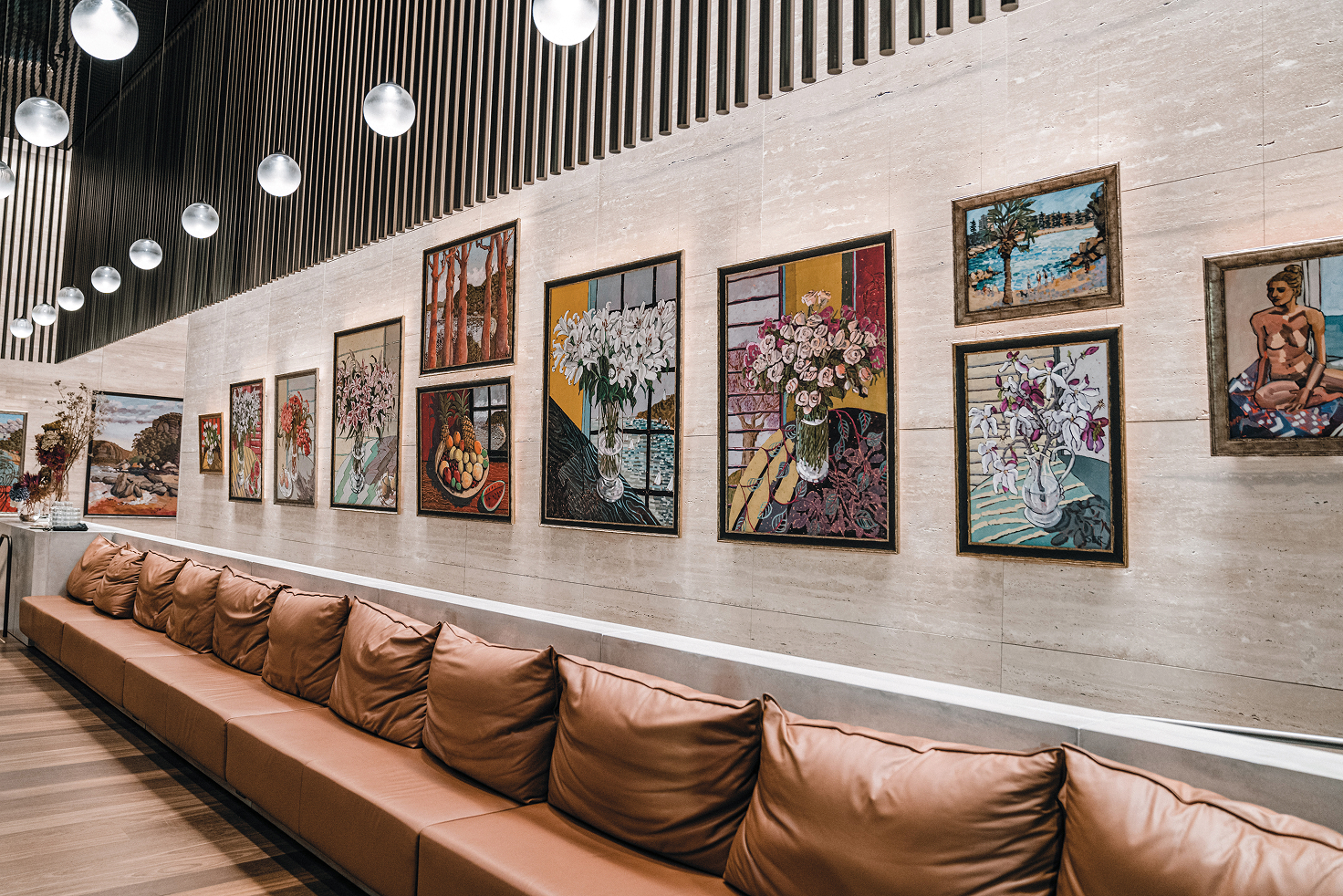 Curated artwork corridor in the 1 Denison lobby