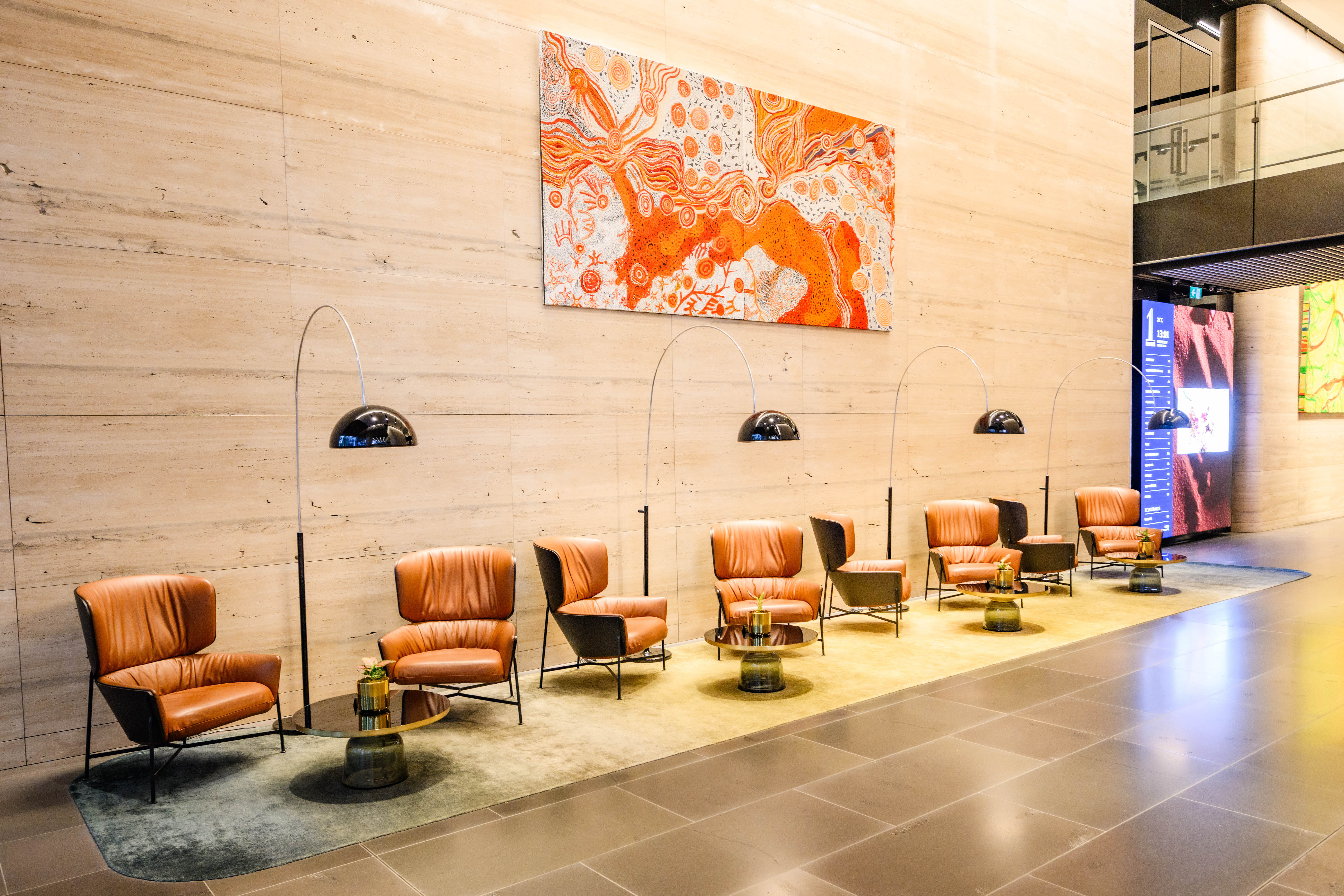 Large orange artwork above 1 Denison lobby seating